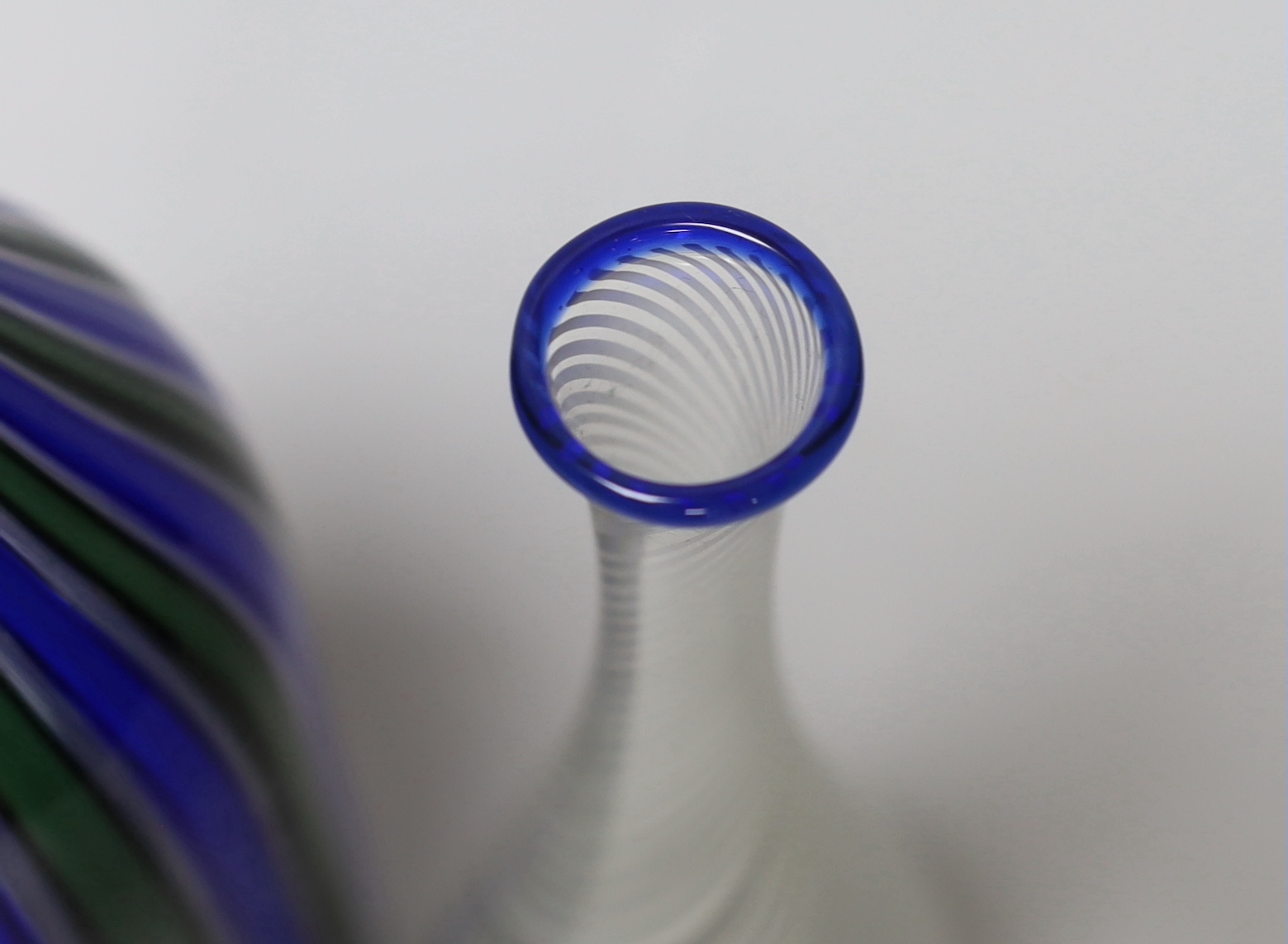Two Venetian glass vases, a blue and green Murano bottle vase and a small Venini style vase with a blue rim, tallest 35cm